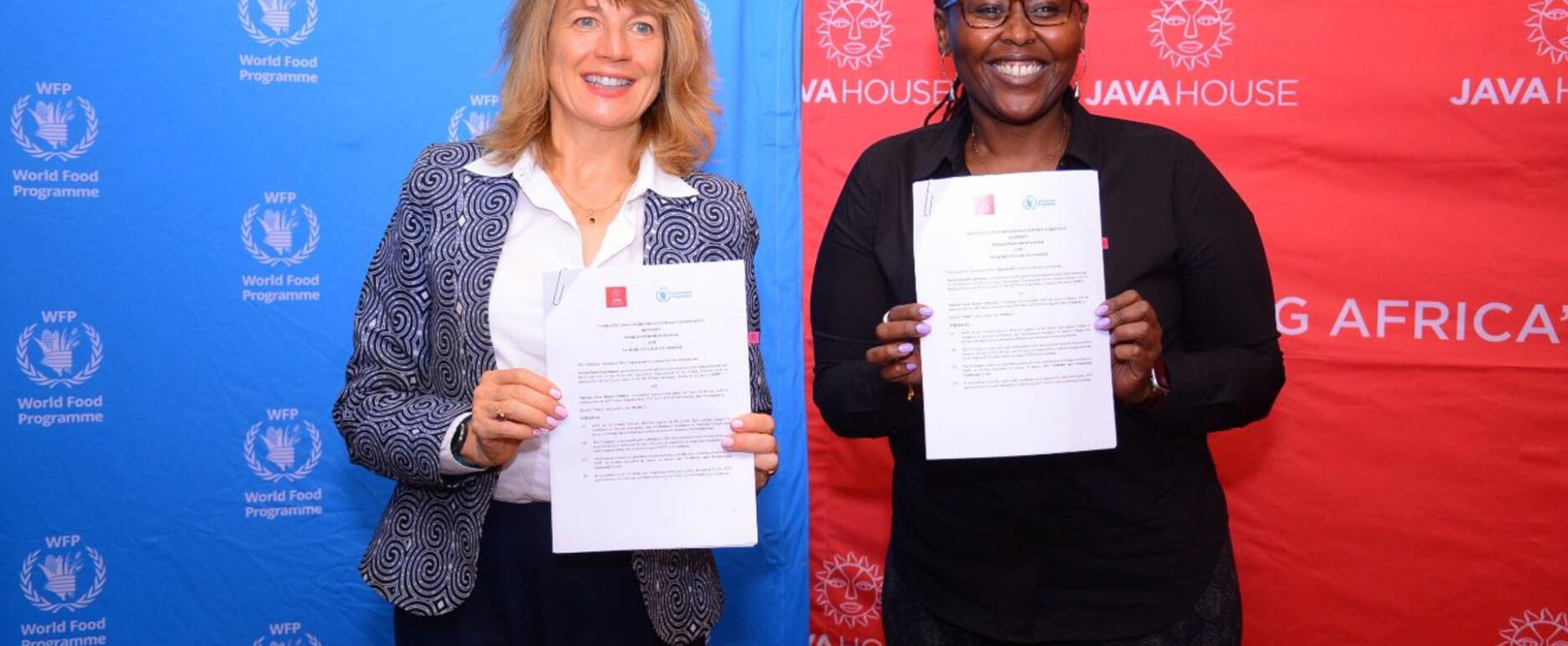 Java House CEO Priscilla and Landis WFP Kenya Country Director all smiles holding MOU for school feeding program | Java Foundation school feeding initiative