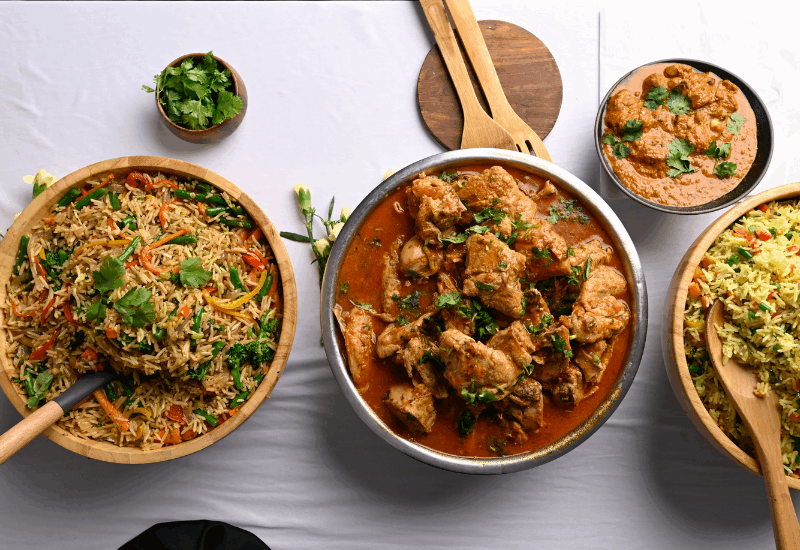 African delicacies served in bowls with wooden serving spoons | Java Group