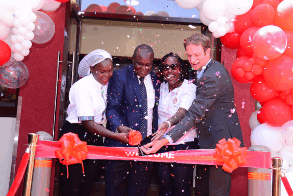 CEO Java House, Priscilla, Hon. Cyrus Nyabicha, CECM for Trade, Tourism, Industry and Marketing, Christophe Wittmann, Commercial Manager – Retail & Card at Total Energies and Java House staff cutting the ribbon at the launch at Java House Kisii